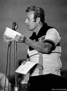 Man holds up bag containing 