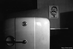 Fridge and picture of four-eyed man reading 