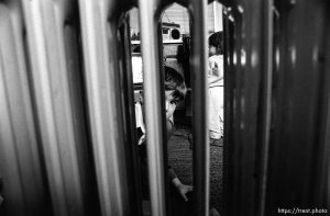 People living in the Hideaway Motel. Boy looking through space heater.
