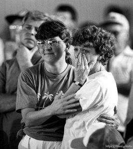 Midway residents listen to officials at a public meeting during the Midway fire.