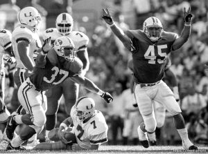 BYU players celebrate sacking Miami QB at BYU vs. Miami football.