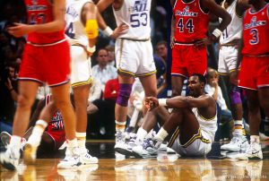 Karl Malone sits on the floor at Utah Jazz vs. Washington Bullets.