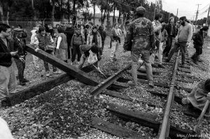 War protesters rip up train tracks at the Naval Weapons Station at Gulf War protest