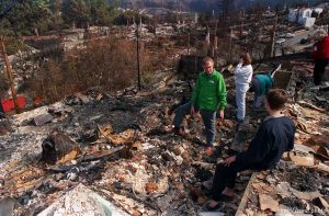 Family searching remains of their home destroyed in the Oakland Hills fire.