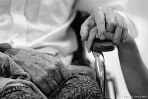 L holds Dan Wilcox's hand