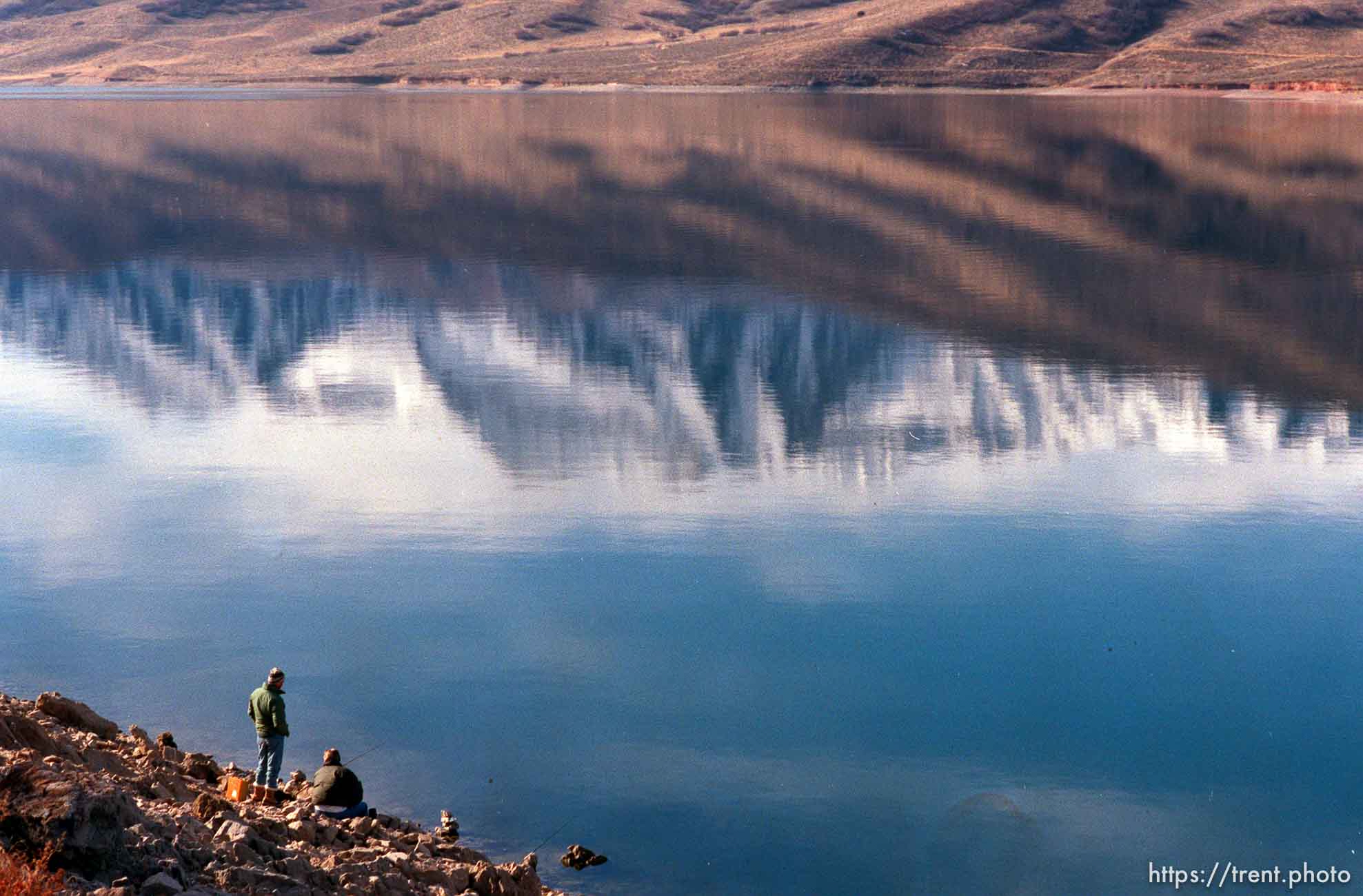 Fishermen on Deer Creek Reservoir with Mt. Timpanogos reflected in water