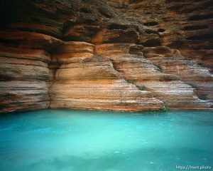 Blue water and rocks in Havisu Canyon. Grand Canyon flood trip.