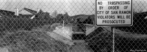 View of San Ramon Creek. through chain-link fence. 