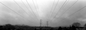 Powerlines and foggy hills