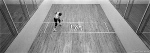John Price serves in a handball game with friends John Barnes and Gary Unker on the Deseret Gym's exhibition handball court. Said Barnes, 