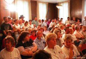 Citizens await the start of a heated city council meeting where the mayor, Jess Green's resignation was called for.