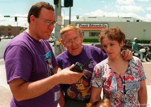 People listen the press conference on a scanner at Apex shoes' promotion when Karl Malone won the NBA MVP award. They had the 