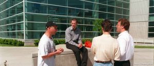 Roger Hale talks to Apex employees at Apex shoes' promotion when Karl Malone won the NBA MVP award. They had the 