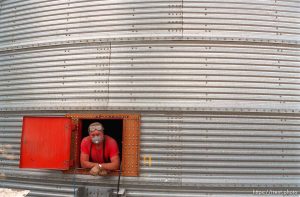 Dick Wagoner, manager of Jack's Bean Company, looks out from inside a grain elevator.