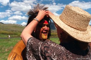 Noah Fred has his wig adjusted by 