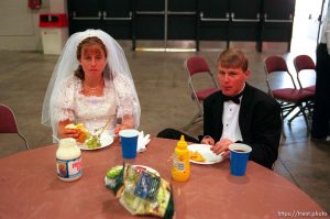 Crystal Dillon and Trevor Schmidt eat lunch. They were at the Salt Palace Convention Center preparing their float for the Days of '47 Parade. They play a bride and groom on the Moses Lake LDS Stake (Moses Lake, Washington).