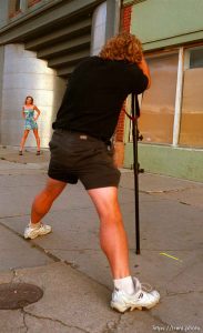 Photographer taking pictures for model's portfolio.