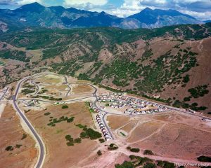 Homes being built shot from the air.