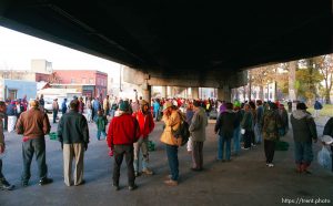 The last Sunday morning breakfast served to the homeless by volunteers under the 400 South viaduct. The viaduct will be torn down as part of the massive freeway construction project.