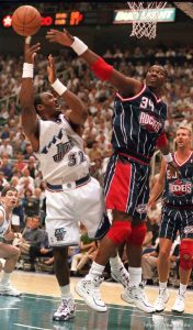 Utah's Karl Malone is blocked by Houston's Hakeem Olajuwon at Utah Jazz vs. Houston Rockets, game 5 of the 1st round, NBA Playoffs. Jazz won.