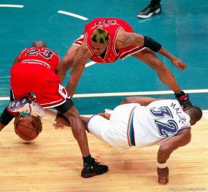Michael Jordan strips the ball from Karl Malone in the last few seconds of Jazz vs. Bulls, game 6 of the NBA Finals. Bulls won. Dennis Rodman at top.