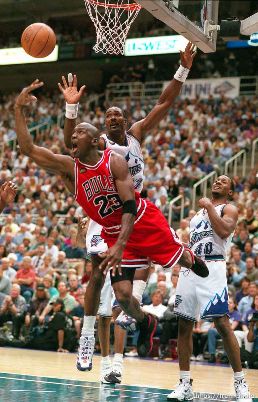 Michael Jordan shoots over Karl Malone at Jazz vs. Bulls, game 1 of the NBA Finals. Jazz won