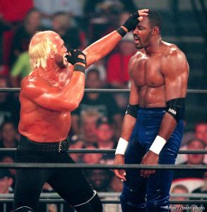 Karl Malone and Hollywood Hulk Hogan wrestle at WCW's Bash at the Beach.