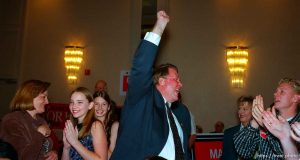 Republican congressman Merrill Cook pumps his fist as he overtakes opponent Lily Eskelsen in the returns on election night. Cook won his re-election