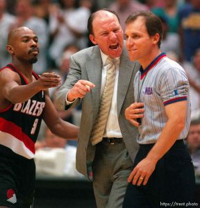 Coach Mike Dunleavy screams at referee Ron Garretson while Greg Anthony tries to hold him back at Jazz vs. Portland TrailBlazers, game five, NBA playoffs, second round. Jazz won