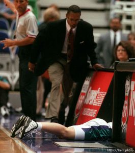 Starzz coach Fred Williams runs over to check on guard Debbie Black after she dove through the scorer's table chasing a loose ball vs. the Los Angeles Sparks. Black was unhurt.
