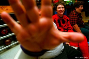 Disabled kids bowling and playing videogames. Guy blocks camera