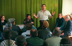 Ed Knowles at a town meeting regarding the reductions in international aid to Kosovo.