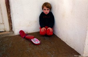 Young Albanian girl with makeup on. Her sisters were putting it on, but ran away out of shyness when we walked by. We stayed at this girl's house for three nights.