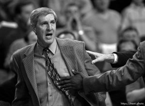 Utah coach Jerry Sloan is restrained after unloading verbally on referee Ron Garretson at Jazz vs. Sonics, game 4, 1st round NBA playoffs. Sonics won.