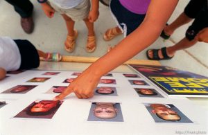 Chidren point to familiar faces on a police suspect poster. These are people they've seen around the Lake Park neighborhood, and about them, they said, 