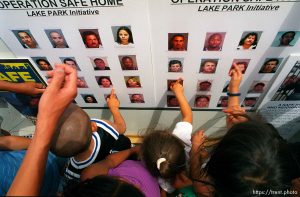 Chidren point to familiar faces on a police suspect poster. These are people they've seen around the Lake Park neighborhood, and about them, they said, 