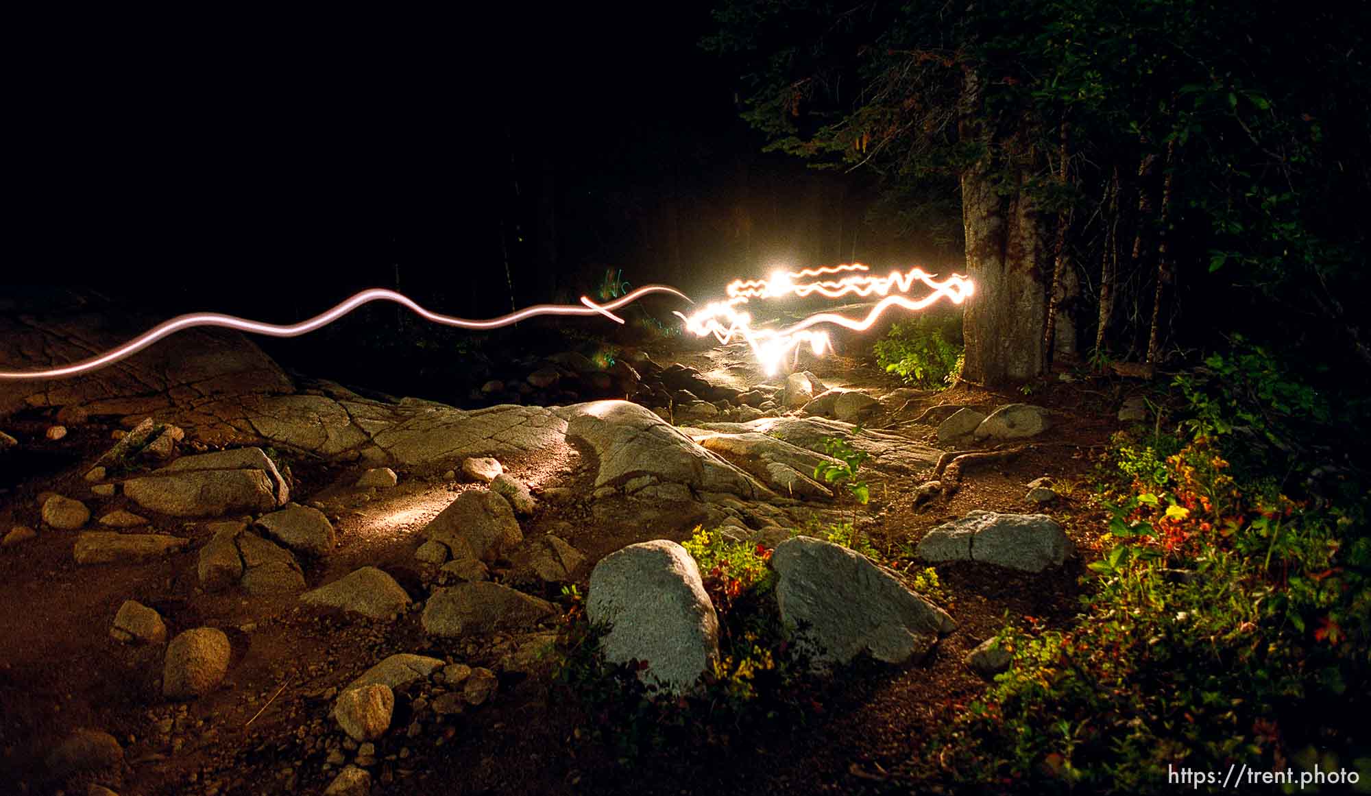 Flashlights light the trail near Brighton. Wasatch 100 Endurance Run.