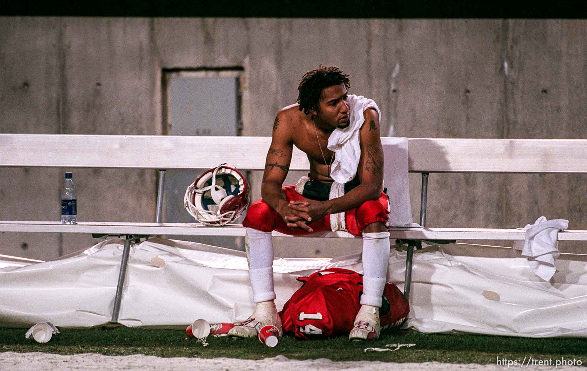 University of Utah quarterback Darnell Arceneaux sits alone with his thoughts on the bench following Utah's loss to Colorado State. The Utes are now 0-4 at home for the season. photo by Trent Nelson. 10/21/2000