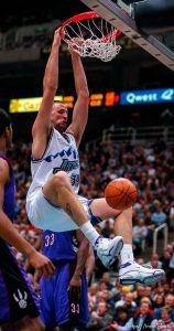 Greg Ostertag dunks as the Utah Jazz face the Toronto Raptors.