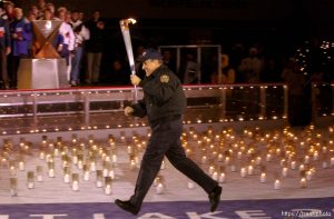 The Olympic Torch commemorates victims and heroes of the World Trade Center attack on a boat near the Statue of Liberty, then proceeds to Rockefeller Plaza where Mayor Giuliani carried the final torch and lit the Olympic cauldron.  12.23.2001, 6:34:38 PM