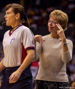 Starzz coach Candi Harvey does a mocking travel call behind game official Sue Blauch after a non-call. Los Angeles Sparks vs. Utah Starzz, game two, WNBA playoffs. 08.24.2002, 3:12:46 PM