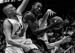 Salt Lake City - Kobe Bryant drives on Greg Ostertag and Andre Kirilenko. Utah Jazz vs. Los Angeles Lakers. 12.04.2002, 7:28:24 PM