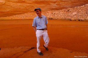 Richard Ingebretsen, founder and president of the Glen Canyon Institute, in Davis Gulch, Lake Powell. Landmarks which had previously been submerged in Glen Canyon are now becoming visible with the lower water levels in Lake Powell. Photo by Trent Nelson; 05.10.2003, 4:50:47 PM