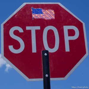 stop sign with american flag. ; 06.25.2003, 2:21:46 PM
