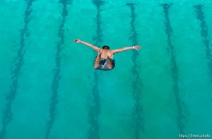 Leaping off the ten meter platform at the Kearns Oquirrh Park Fitness Center in Kearns Wednesday afternoon.