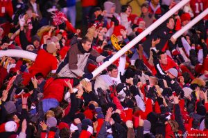 Utah fans swarm the field and down the goalposts. Utah vs. BYU college football. 11.20.2004
