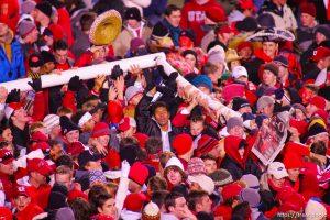 Utah fans swarm the field and down the goalposts. Utah vs. BYU college football. 11.20.2004