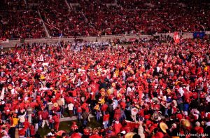 fans swarm the field. Utah vs. BYU college football. 11.20.2004