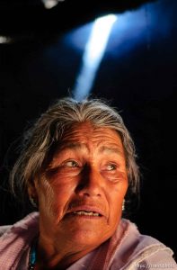 Socorro Avila Morales makes papusas. Morales's children working in Utah have helped her afford to build a newer home than she previously lived in; 12.02.2004