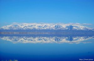 Mountains and snow reflected in Great Salt Lake. Davis County project. 04/05/2005